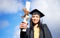 Its one of many more great rewards to come. Closeup shot of a young woman holding her diploma on graduation day.