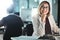 Its satisfying proving the naysayers wrong. a businesswoman sitting at her desk.