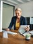 Its such a handy little tool. Cropped portrait of a mature businesswoman working on a tablet in her corporate office.