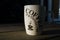 `Its time for coffee` spelled on a coffee cup