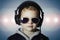 Ittle deejay. funny boy in sunglasses and headphones.child listening music