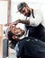 Ive always been passionate about this profession. a handsome mature man getting his beard trimmed and lined up at a