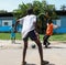 Ivorian child plays soccer Abidjan , Cote d`ivoire- Black african children, boys and adults playing soccer