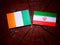 Ivory Coast flag with Iranian flag on a tree stump isolated