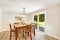 Ivory dining room with walkout patio