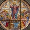 IVREA, ITALY - JULY 15, 2022: The Assumption in the stained glass in the church Santuario Monte Stella