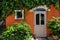 Ivy clad in colourful house