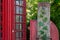 Ivy Postbox with Telephone Box Background in English Countryside.