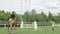 IZHEVSK, RUSSIA, AUGUST 07, 2021. Horse riders jumping over a hurdle.