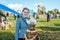 Izmailovsky Park, Moscow, Russia-October 1, 2016: descendants of Cossacks at the fair and Cossack gathering. A woman sells bagels