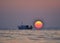 Izmir aliaga yenisakran bay fishermans in the boat and sun