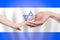 Izraeli baby and parent hands on the background of flag of Izrael Help, aid, support, charity concept