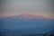 Iztaccihuatl volcano with red tones of sunset