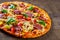 Izza with Chicken meat, Mozzarella cheese, pepperoni, tomato, vegetables, salami. Italian pizza