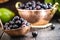 Jaboticaba or jabuticaba, Brazilian and South American fruit, in a copper pot on a rustic table. Fruit for medicinal and culinary