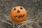 Jack lantern for Halloween of a basketball on scorched earth