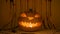 Jack lantern halloween pumpkin, fake blood on background, horror glowing decor