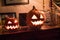 Jack-o`-lantern carved pumpkins on a furniture dribbling.