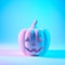 A Jack O Lantern glowing with neon light on Halloween evening. Pastel colors