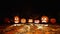 Jack-o-lantern pumpkins in autumn forest at night