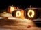 Jack-o-lantern pumpkins on wooden stairs