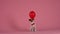 Jack Russell in a red bow tie sits and holds in his mouth a a balloon in the studio on a pink background. The pet runs