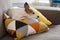 Jack Russell Terrier small dog resting on a pillow with graphic pattern