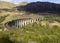 The Jacobite Steam Train crossing the Glenfinnan Viaduct near Fort William in the Scottish Highlands