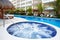 Jacuzzi and a swimming pool at caribbean resort.