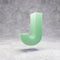 Jade letter J uppercase on rocky backgrond