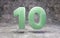 Jade number 10 on rocky backgrond