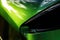A jade production race car close up of its tinted window and sleek headlight shapes. Speed drive concept. AI generation