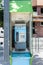 Jaen, Spain - June 18, 2020:  Public telephone kiosk along a town centre street. One of old and useless public phones that remains