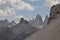 Jagged and dry mountains with rugged peaks and sharp slopes, under a blue sky