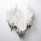 Jagged Edges: Ethereal Dreamscapes In White Paper Sculpture
