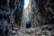 a jagged entrance to a rocky cave canyon