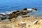 Jagged rocks sticking out of the Atlantic shoreline near Albufeira