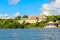 Jagua castle fortified walls with trees and fishing boats in the foreground, Cienfuegos province, Cuba