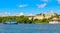 Jagua castle fortified walls with trees and fishing boats in the foreground, Cienfuegos province, Cuba