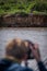 Jaguar being shot by photographer on boat