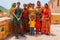 Jaipur, India - August 20, 2009: Group of women and children dressed in typical Indian robes pose for a picture in the fort of