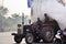 Jaipur, India - December 30, 2014: Indian man driving Heavily overloaded truck in Jaipur.