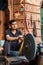 JAIPUR, INDIA - JANUARY 10, 2018: Man grinding on abrasive cutting and knife-sharpening stones.