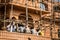 JAIPUR, INDIA - JANUARY 12, 2018: Men builders are resting. Scaffolding. Repair of historic buildings.