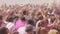 JAIPUR, INDIA - MARCH 21, 2019: slow motion clip of a girl blowing powder off her hand at a holi party in jaipur