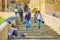 Jaipur, India - September 19, 2017: Unidentified people walking dowstairs at outdoors, and a homeless holding an