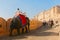 Jaipur, Rajasthan, India, December, 28 - 2019 : Tourists ride decorated elephants at Amber Fort Jaipur, Rajasthan. Amer Fort is a