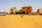 Jaisalmer, India - August 20, 2009: some isolated houses along a deserted road near Pokaran, rajasthan, india