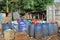 Jakarta, Indonesia - 06082020: Temporary residents` garbage shelter. Blue barrel to store trash. Trash clinic and household trash.