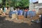 Jakarta, Indonesia - 06082020: Temporary residents` garbage shelter. Blue barrel to store trash. Trash clinic and household trash.